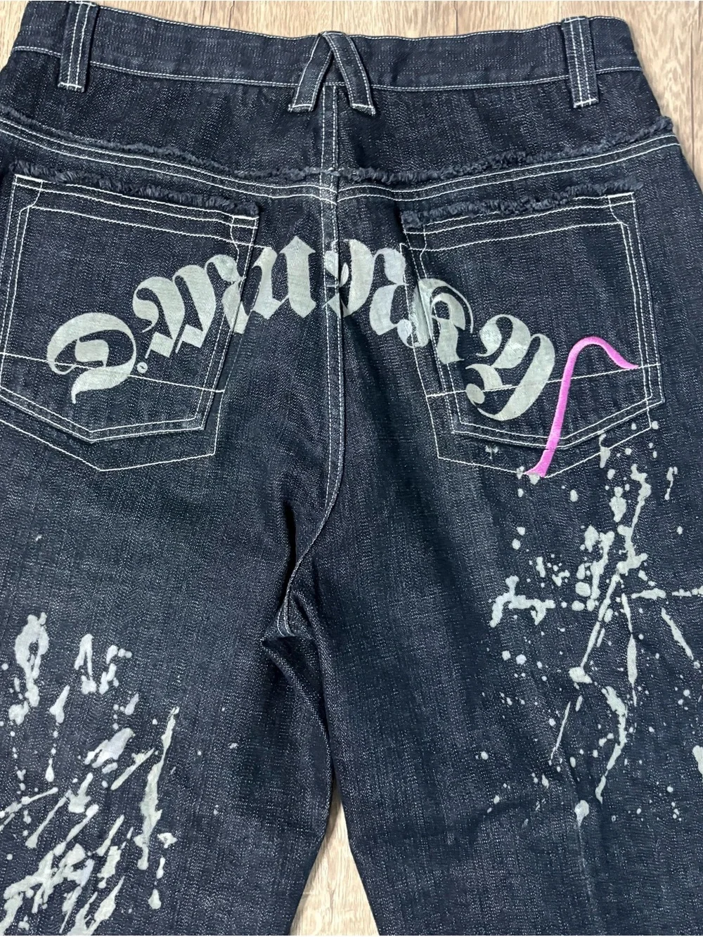 These wide-leg black jeans with white paint splatters Size 36x28
